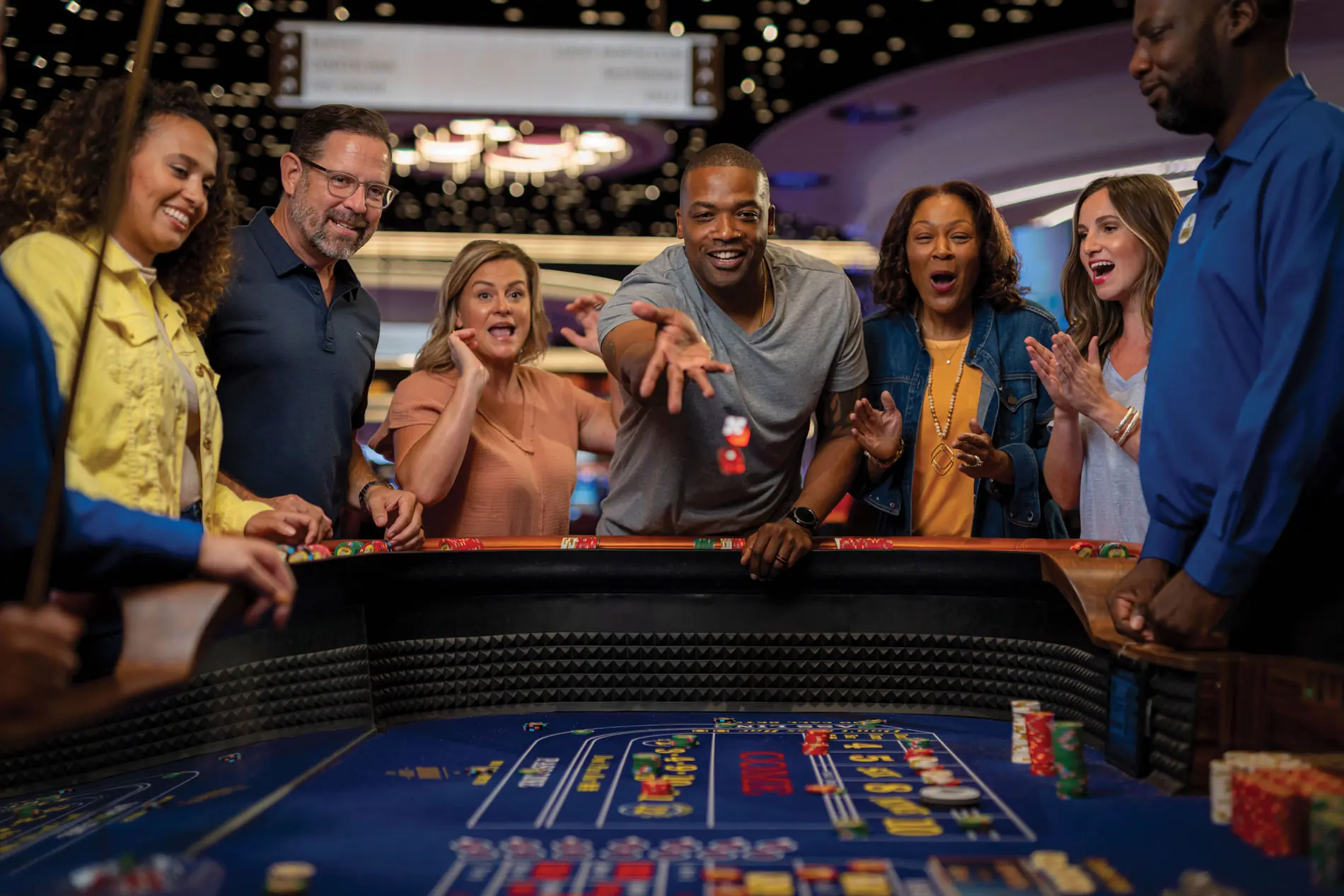 Man throwing dice down a table game at Southland Casino